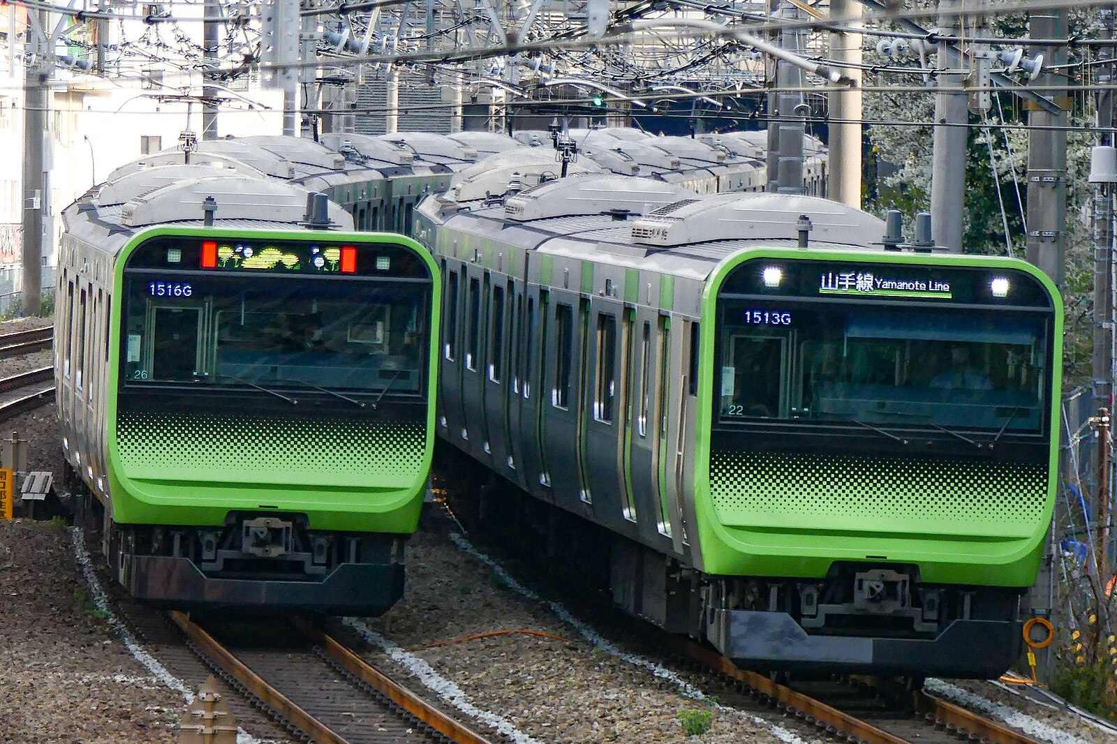 A JR East E235 series train in Yamanote Line livery.
